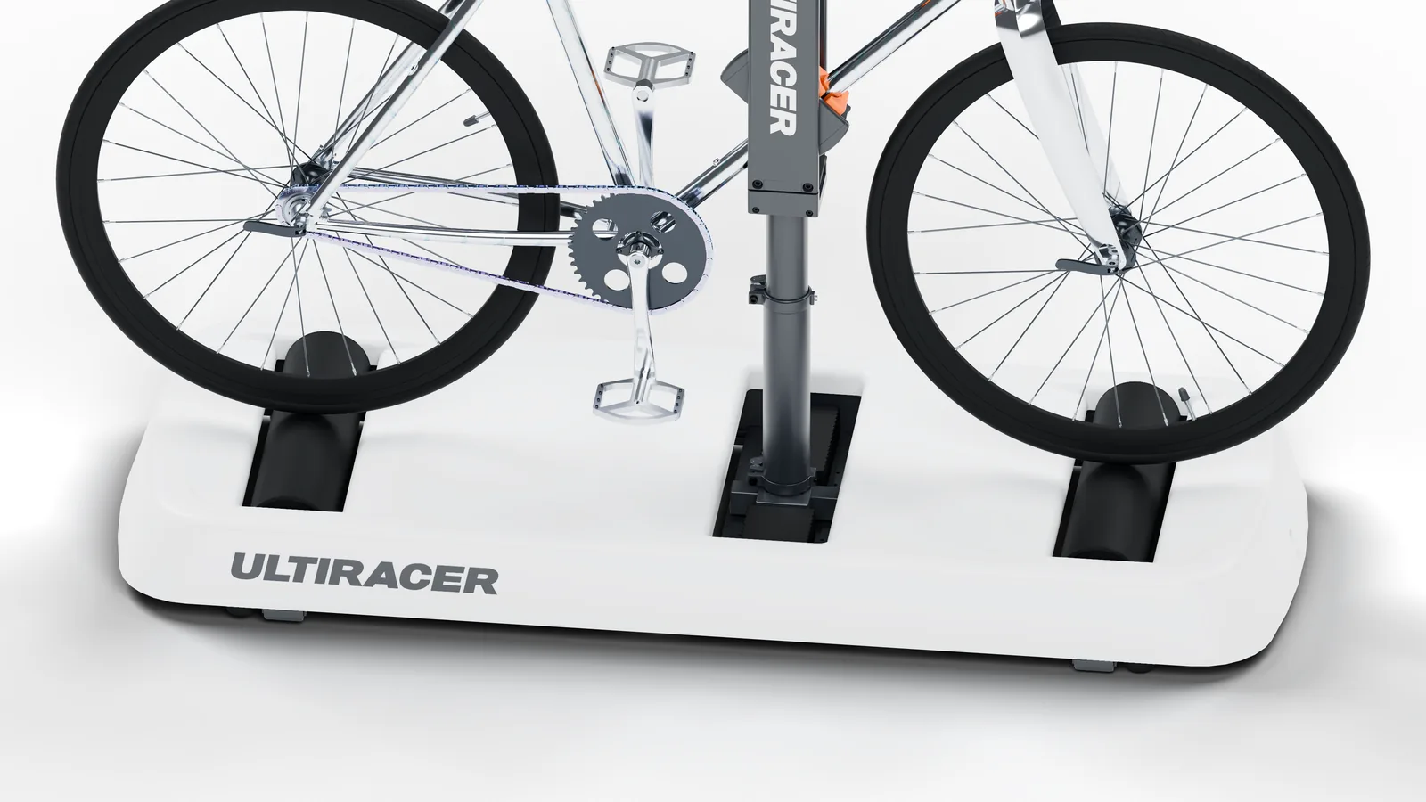 白色平台上的 Ultiracer 前后滚筒托住银色自行车的轮胎