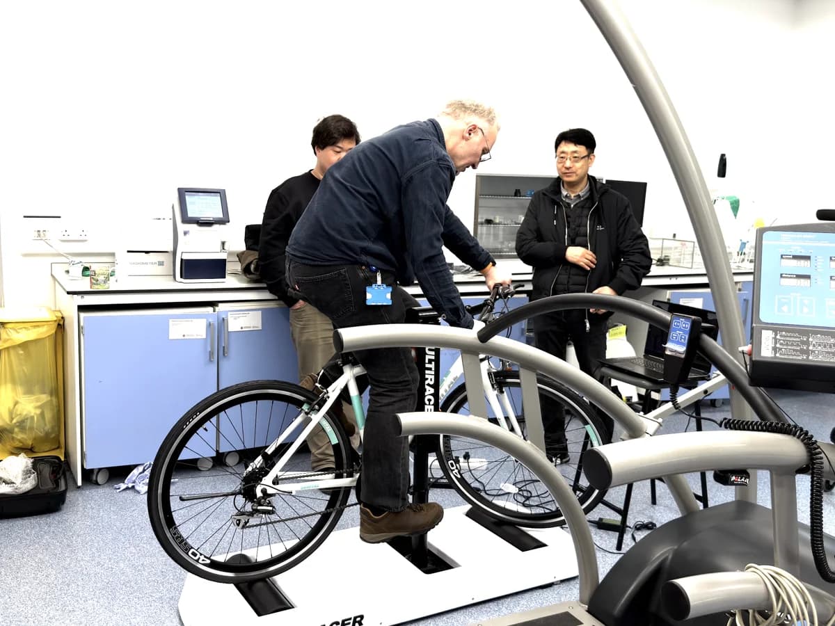 Researchers testing the Ultiracer trainer in a university laboratory